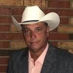 Dennis Salzman wearing a white cowboy hat